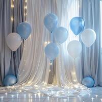Light blue and white balloons with led string lights hanging from ceiling. photo