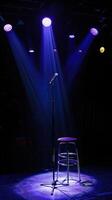 The spotlight is on an empty stool on a stage. photo