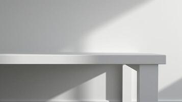 White table in front of white wall with soft lighting photo