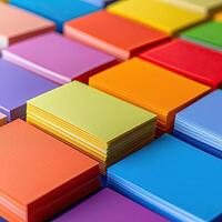 A collection of multicolored sticky note pads, with the edges perfectly aligned, creating a rainbow of potential ideas, vivid and inspiring photo