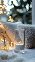 Blank clear straight candle glass amidst a setting with a plush pillow, a scented diffuser, and delicate string lights, modern warm bedroom mockup, serene and stylish photo