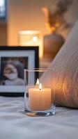 Blank clear straight candle glass amidst a setting with a plush pillow, a scented diffuser, and delicate string lights, modern warm bedroom mockup, serene and stylish photo