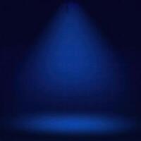Dark blue background with a spotlight creating an empty stage effect, perfect for presentations, performances, and dramatic scenes. photo