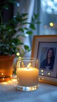 Blank clear straight candle glass surrounded by a stack of books, a small vase with flowers, and warm ambient lighting, modern warm bedroom mockup, chic and cozy photo