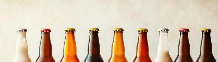 1 An artistic arrangement of several craft beer bottles, varying heights and colors, set against a uniform, lightcolored background, broad negative space for text photo