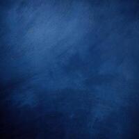 Dark blue grunge textured background, ideal for design projects, backdrops, and creative applications with a moody, vintage feel. photo