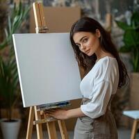 Girl painter at a stylish art studio, leaning close to a white canvas on an easel as she begins her artwork, creative hobby, dedicated and thoughtful photo