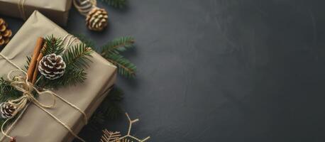 Christmas gift box with pinecone and cinnamon stick decoration on a dark background. Festive holiday concept with natural elements and rustic style photo
