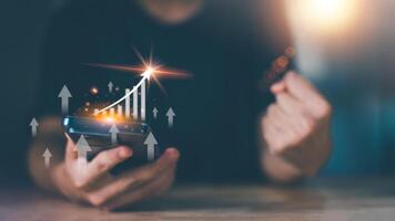 Businessman showing business growth and success graph ,concept of progress in development, financial efficiency and investment with business strategy for goals and opportunities in industry future photo