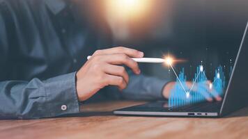Businessman showing business growth and success graph ,concept of progress in development, financial efficiency and investment with business strategy for goals and opportunities in industry future photo