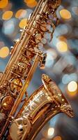 The gleaming golden saxophone reflects warm lights, bokeh background. Jazz music. Vertical banner photo