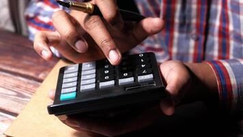 Close up of man hand using calculator video