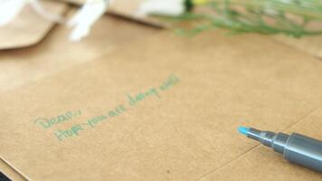 envelope , empty paper and a pen on table video