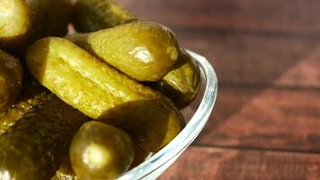 a close up of a pickle on a plate with tomatoes video