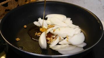 Sauting Onions and Garlic in a Pan video