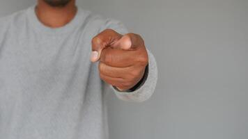 The Confident Gesture A Pointing Hand is Captured in Sharp Focus for Powerful Expression video