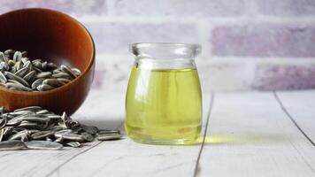 sunflower oil seed and oil in a container on table video