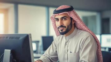 Portrait of Arab man working with computer in office photo