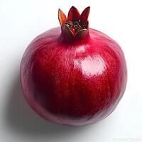 pomegranate isolated on white background with shadow. autumn fall harvest of ripe pomegranate fruit full of juice photo