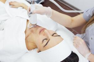 Microneedle RF lifting procedure. Hardware cosmetology. photo