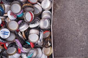 turkey istanbul 18 january 2024. Assorted bottle caps create a colorful background, ideal for beverage, beer, and soda designs photo