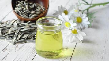 sunflower oil seed and oil in a container on table video