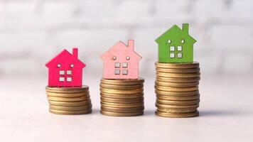 stack of coins and house on table , the concept of house finance video