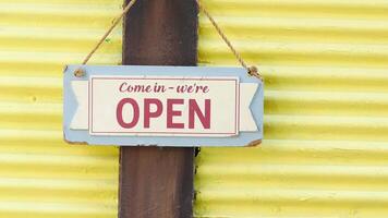 A Bright Yellow Wall featuring an Open Sign creates a Welcoming and Inviting Atmosphere video
