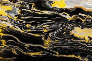 Yellow inclusions in black waves and curls. Marble effect background or texture. Fluid Art photo