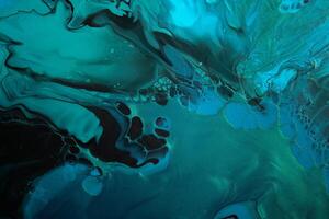 Fluid Art. Metallic Green and blue abstract wave swirls on black background. Marble effect background or texture photo