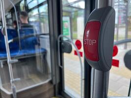 Stop button on the public transport bus. City transport. Stop button on a bus. photo