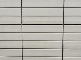 Close up tile brick wall. Clean solid material background Textures horizontal images for design Art, construction and architecture photo