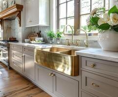 Elegant kitchen with gray cabinetry and large windows photo