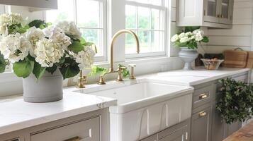 Elegant kitchen with gray cabinetry and large windows photo