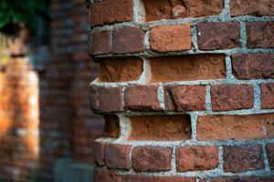 Old, broken bricks of the column photo