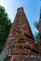 Old, brick column, bottom-up view photo