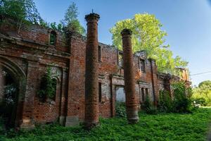 The columns of the destroyed red brick stable. 19th century buildings photo