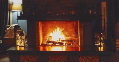 Burning fireplace, close up. Cozy atmosphere autumn or winter evening photo