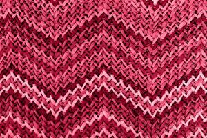 a red and pink knit pattern with a zigzag pattern photo