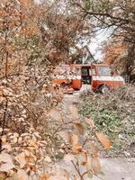Retro minivan stands against the background of autumn leaves. Stop for a picnic. photo