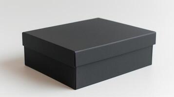 a black box sitting on a white surface photo