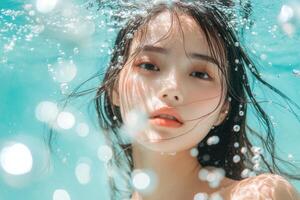 Beautiful woman with wet hair surrounded in the style of bubbles and water droplets floating in the air. photo