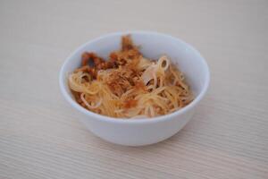 Fried vermicelli noodles in white bowl background photo