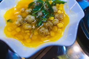 Stir fried water spinach with snails served in dish isolated on grey background top view of seafood photo