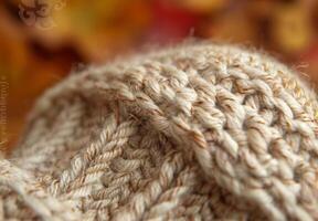 A close up of a knitted wool sock, showing the interlocking fibers and pattern photo