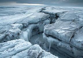 A detailed shot of the cracks forming in a melting glacier photo