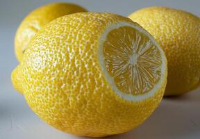 A detailed view of a lemons textured surface, showing its bright yellow color and tiny pores photo