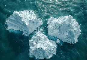 A detailed view of melting icebergs breaking apart and floating in the sea photo