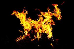Fire flame texture. Burning material backdrop. Burn effect pattern. Blaze and torch wallpaper. Heat and haze backdrop. photo