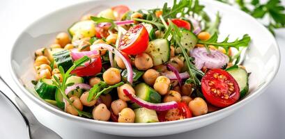 Vegetarian chickpea salad prepared with tomatoes, cucumber, red onion, cress salad and arugula, White Background, photo